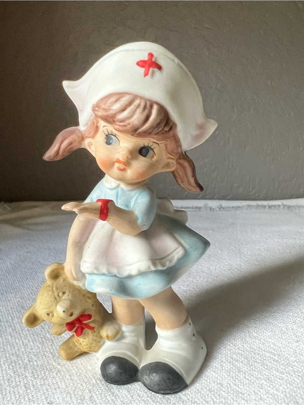 vintage Royal Crown porcelain nurse figurine holding a teddy bear
Blue box